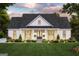 Charming one-story home with a welcoming front porch, rocking chairs, and manicured landscaping at 380 Ayers Rd, Bowdon, GA 30108