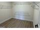 Walk-in closet with laminate wood flooring and ventilated metal shelving at 368 Cantrell Drive, Dallas, GA 30157