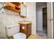 Bathroom featuring a vanity and decorative wallpaper, located in a convenient layout at 65 Pine Haven Ct, Carrollton, GA 30116