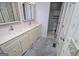 Bright bathroom features double vanity and a doorway to the shower/toilet room at 65 Pine Haven Ct, Carrollton, GA 30116
