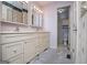 Bright bathroom features dual sinks and a doorway to the shower/toilet room at 65 Pine Haven Ct, Carrollton, GA 30116