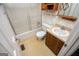 Bathroom showcasing a vanity and shower with glass doors, providing a private retreat at 65 Pine Haven Ct, Carrollton, GA 30116