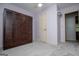 Well-lit bedroom featuring a wardrobe, door, and a carpet provides ample space at 65 Pine Haven Ct, Carrollton, GA 30116