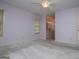 Spacious bedroom with a window, carpet, and an en-suite bathroom offers a calm space at 65 Pine Haven Ct, Carrollton, GA 30116