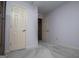 Bedroom displaying a wardrobe, carpet, and multiple doors leading to other rooms at 65 Pine Haven Ct, Carrollton, GA 30116