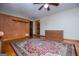 Large bedroom features hardwood floors, ceiling fan, and built-in drawers at 65 Pine Haven Ct, Carrollton, GA 30116