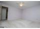 Bright bedroom features neutral carpet, ceiling fan, and fresh paint at 65 Pine Haven Ct, Carrollton, GA 30116