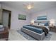 Staged bedroom boasts neutral carpet, ceiling fan, and calming decor at 65 Pine Haven Ct, Carrollton, GA 30116