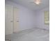 Bright bedroom with light gray walls, carpet, and double doors offers a quiet space at 65 Pine Haven Ct, Carrollton, GA 30116