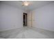 Bedroom showcasing open double doors leading to the adjoining bathroom and neutral carpet at 65 Pine Haven Ct, Carrollton, GA 30116