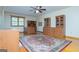 Spacious bedroom features hardwood flooring, ceiling fan and custom built-ins at 65 Pine Haven Ct, Carrollton, GA 30116