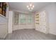 Light filled breakfast nook with updated floors and bay windows offers charming space for morning coffee at 65 Pine Haven Ct, Carrollton, GA 30116