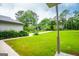 Lush, green front yard of a well-maintained home with mature trees at 65 Pine Haven Ct, Carrollton, GA 30116