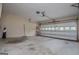 Spacious garage with concrete floor and automatic door at 65 Pine Haven Ct, Carrollton, GA 30116