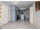 Bright kitchen featuring modern stainless steel appliances, grey cabinetry, and an eat-in island at 65 Pine Haven Ct, Carrollton, GA 30116