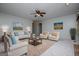 Staged living room featuring neutral tones, coordinated decor, with a cozy and inviting feel at 65 Pine Haven Ct, Carrollton, GA 30116