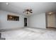 Spacious living room with new carpet, lots of natural light, and a view of the kitchen at 65 Pine Haven Ct, Carrollton, GA 30116