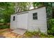 Metal storage shed with small windows and ramp at 65 Pine Haven Ct, Carrollton, GA 30116