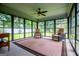 Bright sunroom with large windows offering serene outdoor views at 65 Pine Haven Ct, Carrollton, GA 30116