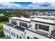 Aerial view of townhome exteriors, highlighting rooftop terraces and modern architectural details at 2118 Iverson Se Dr, Smyrna, GA 30080