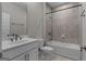 Bright bathroom with a tub-shower combination, single vanity, and tile flooring at 2118 Iverson Se Dr, Smyrna, GA 30080