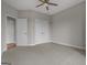 Bedroom with plush carpeting, double closets, and neutral wall paint for a modern, relaxing space at 2118 Iverson Se Dr, Smyrna, GA 30080