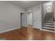 Hallway with hardwood floors leading up the stairs at 2118 Iverson Se Dr, Smyrna, GA 30080
