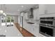 Modern kitchen featuring stainless steel appliances, white cabinetry, and sleek countertops at 2118 Iverson Se Dr, Smyrna, GA 30080
