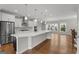 Bright, open kitchen with white cabinets, stainless steel appliances, and large center island at 2118 Iverson Se Dr, Smyrna, GA 30080