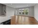 Bright living room with hardwood floors, large windows, and access to a balcony at 2118 Iverson Se Dr, Smyrna, GA 30080