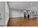 Spacious living room with hardwood floors leading into an open-concept kitchen at 2118 Iverson Se Dr, Smyrna, GA 30080