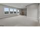 Spacious loft featuring carpeted floors, abundant natural light, and access to an outdoor balcony at 2118 Iverson Se Dr, Smyrna, GA 30080