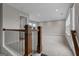 Second floor living space with a stair railing and lots of natural light at 2118 Iverson Se Dr, Smyrna, GA 30080