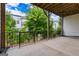 A concrete patio with black metal railings featuring a view of a lawn and neighboring homes at 2118 Iverson Se Dr, Smyrna, GA 30080