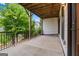 A covered patio with a black metal railing, perfect for outdoor relaxation and entertaining at 2118 Iverson Se Dr, Smyrna, GA 30080