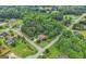 A wooded neighborhood showing houses among the trees with a street running through, offering a secluded feel at 52 Olivia Ct, Palmetto, GA 30268