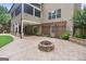 Backyard patio with fire pit, pergola, and screened-in porch, perfect for entertaining at 52 Olivia Ct, Palmetto, GA 30268