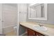 Bright bathroom with updated sink, decorative mirror, and walk in shower at 52 Olivia Ct, Palmetto, GA 30268