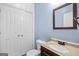 Cozy bathroom with classic vanity, commode, and built-in linen closet at 52 Olivia Ct, Palmetto, GA 30268