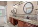 Bright bathroom boasting granite counters, dual sinks, warm lighting, and a walk-in doorway to the bedroom at 52 Olivia Ct, Palmetto, GA 30268
