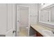 Neutral bathroom with modern sink, decorative mirror, and walk in shower at 52 Olivia Ct, Palmetto, GA 30268