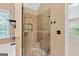 This bathroom features a walk-in tiled shower with glass door, enhancing the spa-like feel of this home at 52 Olivia Ct, Palmetto, GA 30268