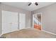 Bedroom featuring neutral walls, carpet flooring, closet, and view of stairway at 52 Olivia Ct, Palmetto, GA 30268