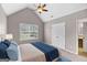 Bedroom boasts vaulted ceiling, ceiling fan, window, closet and bed at 52 Olivia Ct, Palmetto, GA 30268