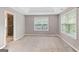 Large bedroom featuring tray ceiling, ceiling fan and 2 windows at 52 Olivia Ct, Palmetto, GA 30268