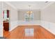 Dining room featuring hardwood floors, chair rail, decorative trim, and window at 52 Olivia Ct, Palmetto, GA 30268