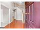Bright foyer with gleaming hardwood floors, a staircase, and an open layout creating an inviting entry at 52 Olivia Ct, Palmetto, GA 30268