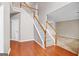 Spacious foyer with hardwood floors and staircase and an open layout into other rooms at 52 Olivia Ct, Palmetto, GA 30268