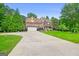 Beautiful two-story brick home with attached garage, manicured lawn, and inviting curb appeal at 52 Olivia Ct, Palmetto, GA 30268