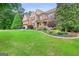Charming brick home with a well-kept lawn and inviting front porch in a desirable neighborhood at 52 Olivia Ct, Palmetto, GA 30268
